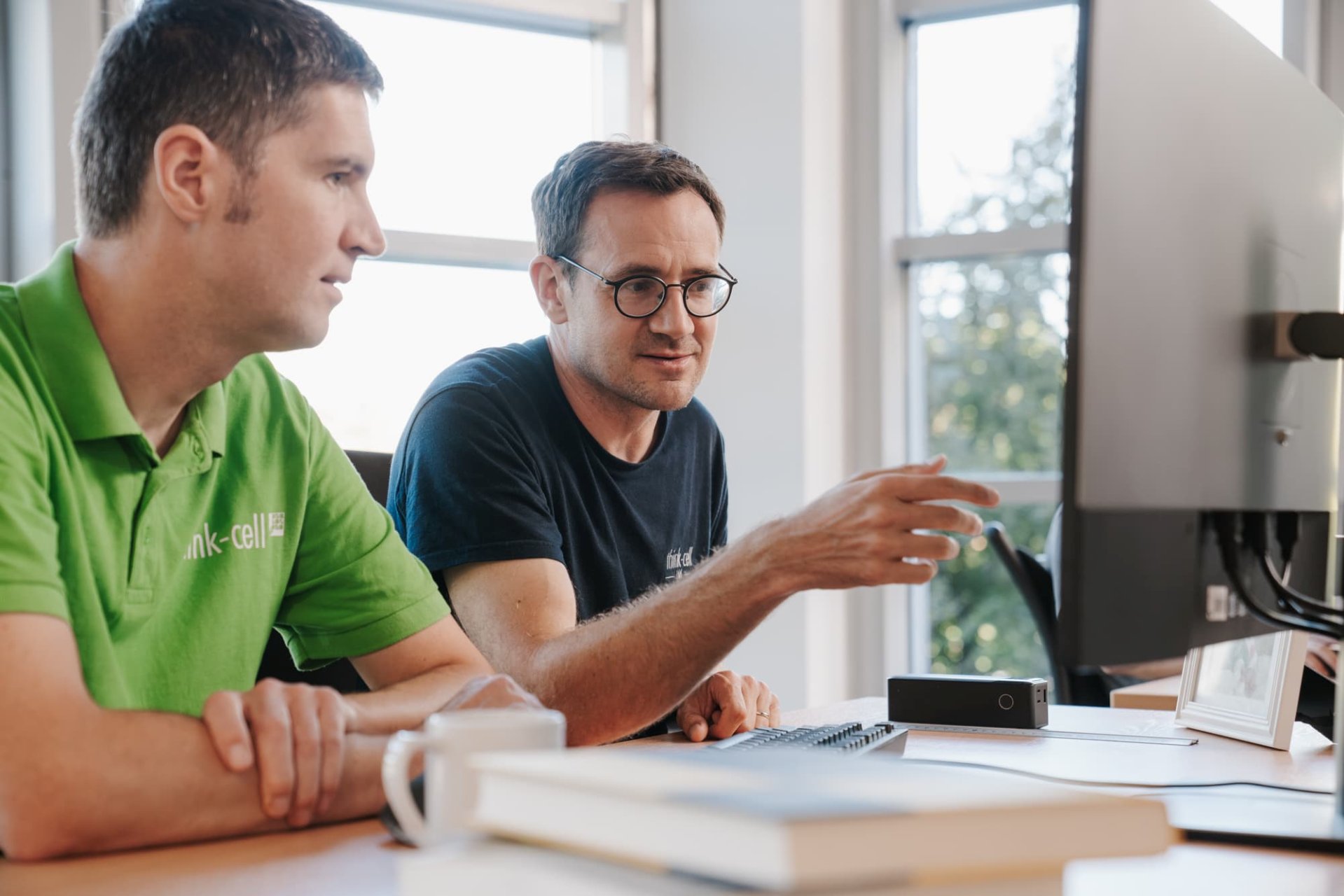 Two members of development team doing a code review.
