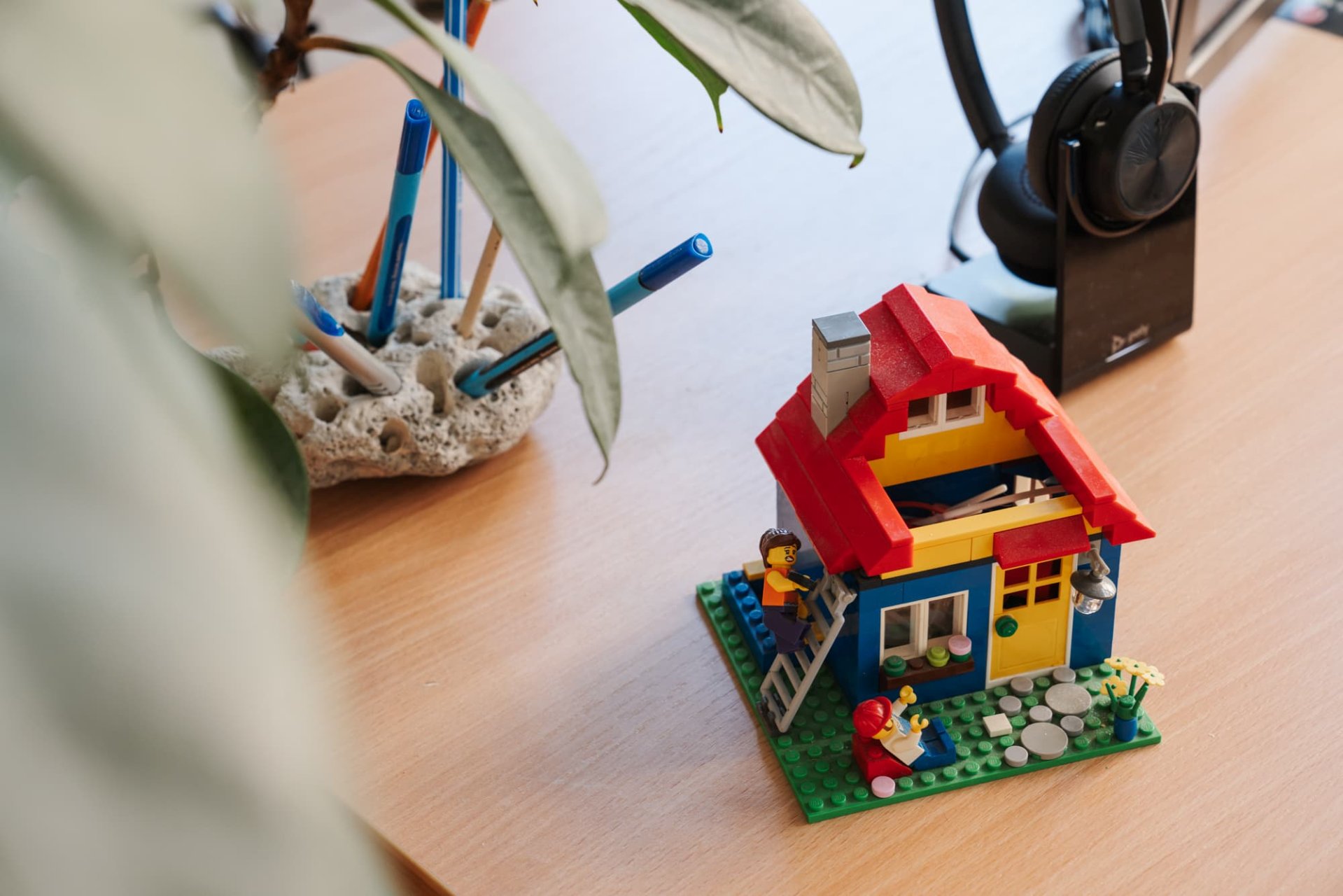 Colorful Lego house at an employees desk.