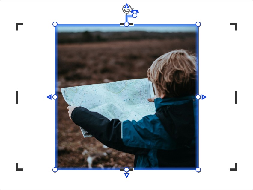 An image of a boy holding a map